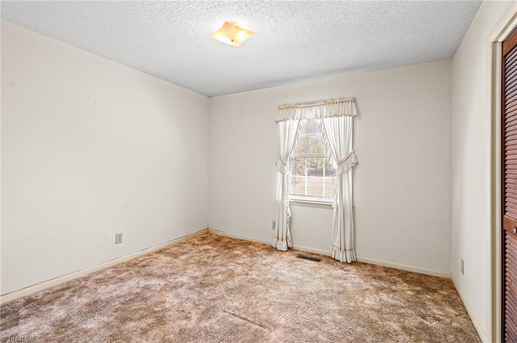 Bedroom floor replacement before photo in Summerfield, NC